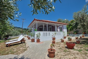 The cottage front ,large sheltered balcony offering lots of shade  