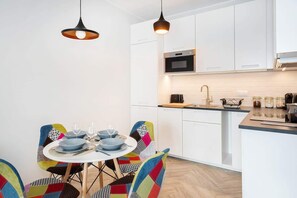 Fully equipped kitchenette with dining table. 