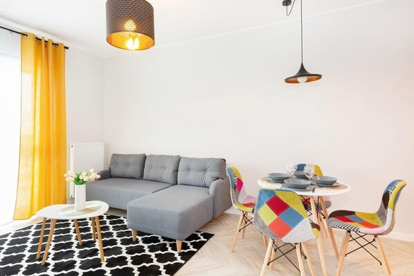 Living room with a comfortable sofa and TV. 
