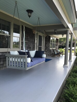 Covered front porch with swing

