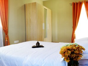 Simple yet charming and elegant, the bedroom has storage space and necessities