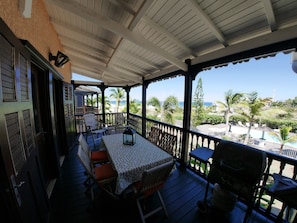 The terrace overlooking the ocean, the marina, the pool and the garden.