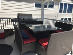 Covered outdoor table for 8 and 5 burner Weber grill for cooking