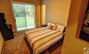 bedroom 3 with queen size bed and private show/tub