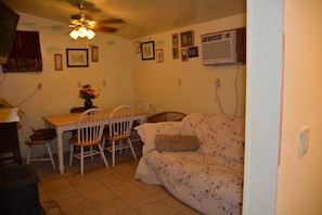 Common Room. Dish tv, double bed futon, table with 6 chairs