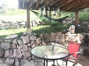 Covered area of back patio.  White lights and beer bottle chandelier!