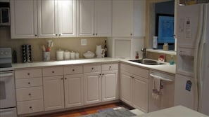 White on white and sparkling clean kitchen!