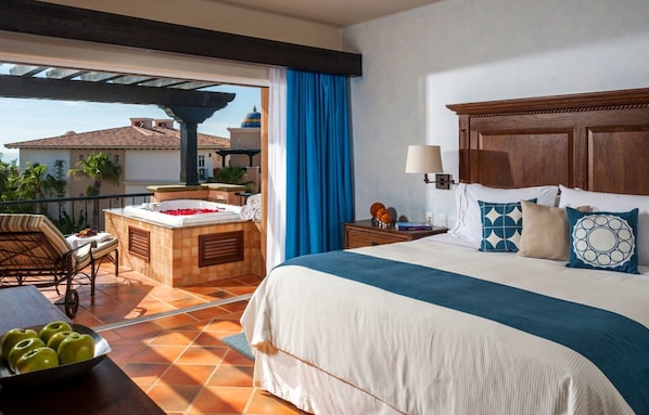 Master bed with private balcony and hot atub