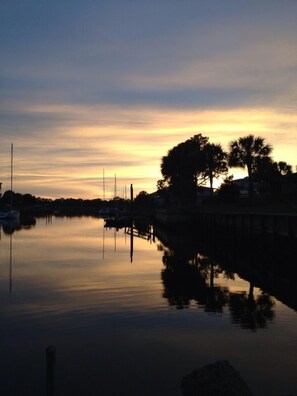 sun setting over water