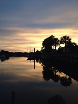 sun setting over water