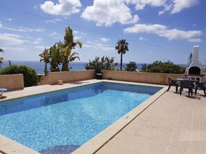 The villa has a very big private pool, brick-built BBQ and panoramic sea views