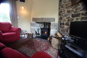 Cottage lounge with woodburner