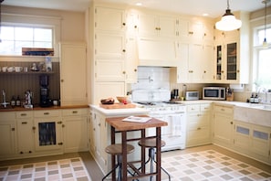 Hand-crafted cabinets fill the kitchen