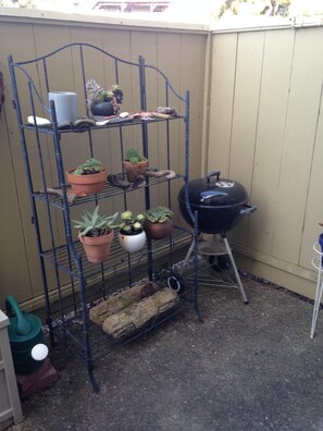 patio with chairs and bbq