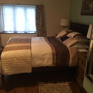 Room1 large double. King size bed with down duvet and deep mattress.