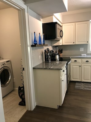 Kitchen with adjoining laundry room