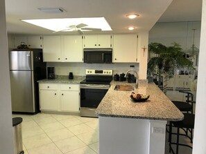 Kitchen view with new granite counters.