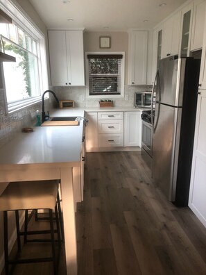 Remodeled Galley Kitchen with Lots of Natural Light, New Cabinets/ Appliances  
