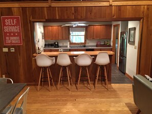 Bar area looking into kitchen!  4 Eames style barstools.  Very comfortable!