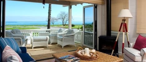 Ocean view from the living room with patio doors open.