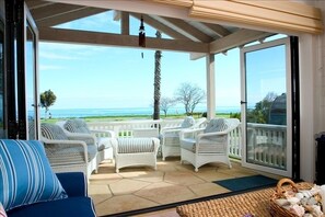 Ocean view from living room with patio doors open.