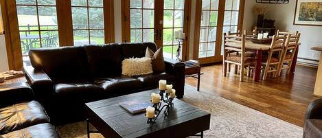 Great Room with wall of windows looking onto the Eagle Vail Golf Course