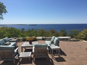 Expansive patio with comfortable seating and dining table for four