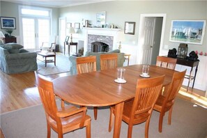 Dining Area Looking into Living Room with Door to Back Yard Area