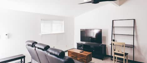 Guest Unit Living Room with Reclining Sofa, 55" TV, and Office Desk