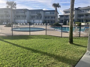 From unit looking straight toward fenced pool area