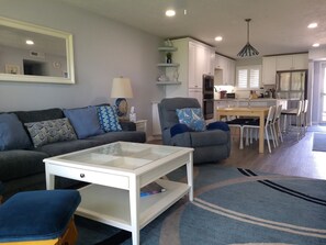 Living room area looking toward dining and kitchen