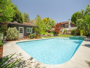 View from backgarden with pool, terrace, gas BBQ, fire pit and Santa Maria grill