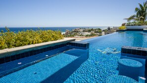 Swim up bar/spa open to the infinity pool.  