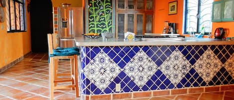 handpainted mural is centerpiece of kitchen