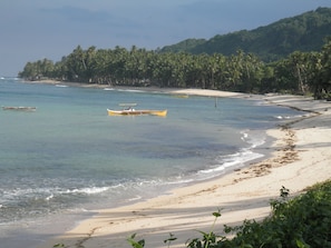View looking South along the beach.  Boats can be rented for fishing