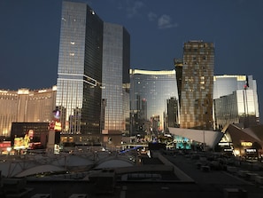 View from our condo overlooking the strip to City Center at dusk