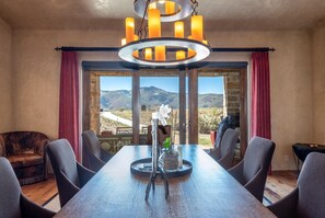 Dining table with views of gorgeous Park City mountains and the backyard.  