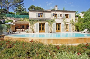 Charming view from the roses-parterre across the pool 