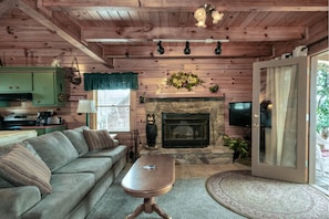 Cozy Living Room with wood burning fireplace.