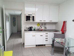 Kitchen bottom l to r. Fridge, sink, draws, 4 ring hob and dish washer.