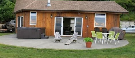 Cottage, view from the beach front showing ample parking by the front door