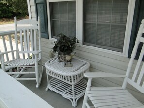 Relax and listen to the beach on the front porch rockers.