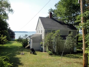 View of house and water from the road (Note: The red house is no longer there.)