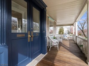 Door with wrap around porch