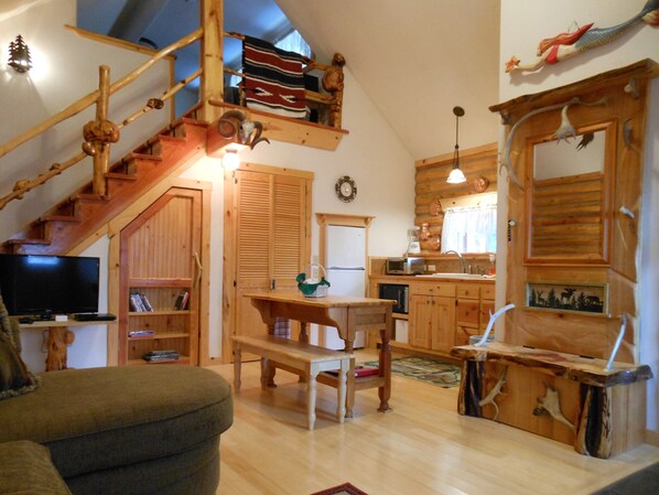 Kitchenette, loft bedroom, beautiful woodwork throughout.