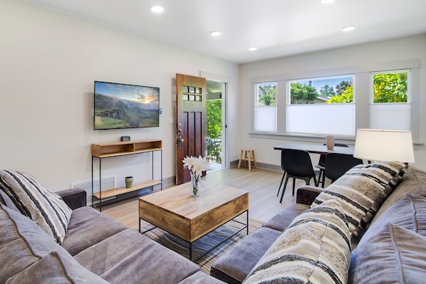 another view of the main living area with dining table at the window