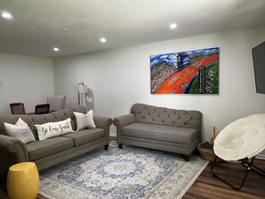 Living Room/Dining Room combo with TV and Sleeper Sofa.
