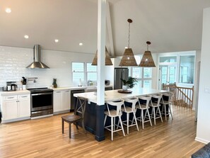 Newly renovated kitchen. Induction oven. Two dishwashers. Quartz countertops. 