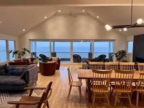 Reverse living, kitchen & living area on second floor. 270 degree view of water.