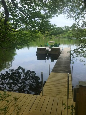 View of the dock, with a floating platform at the end, and a raft